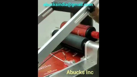 bottle sticker labeling machine with inkjet batch coding machine attached.