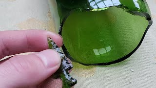 Flint knapping green glass Arrowhead from wine bottle