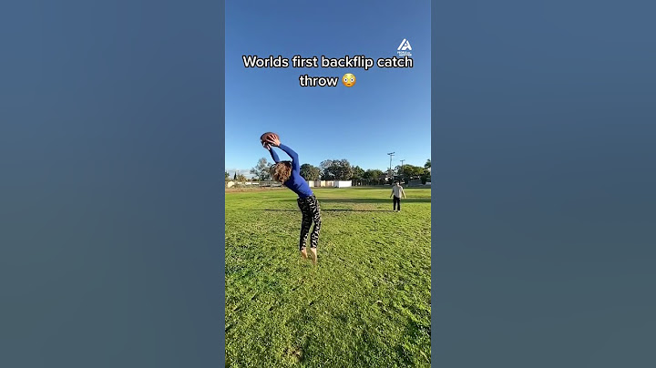 Guy Does Catch and Throw While Performing Backflip