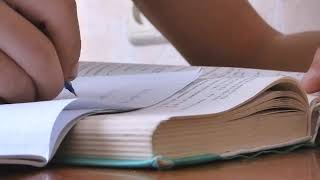 On The Table Lies A Thick Textbook   12040