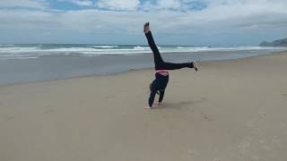 Madison Doing Cartwheel On Oregon Beach