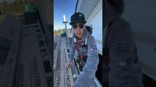 Installing vinyl shakes in a gable using a DeWalt roofing nailer with siding tip
