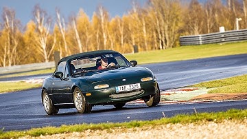 Drifting stock Miata on racetrack. 1.8 Open diff