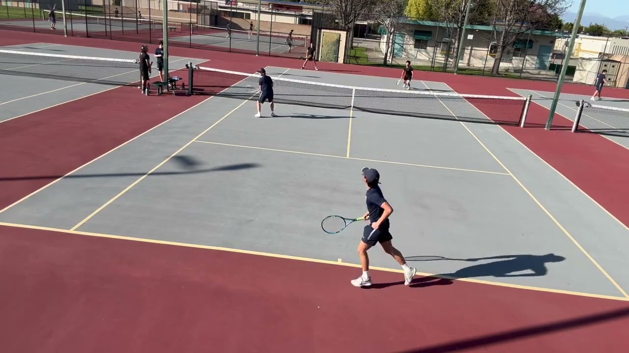 03 05 26 Varsity Tennis vs Manatha doubles #1 court