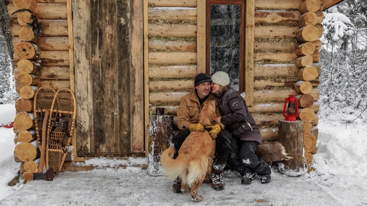 off grid cabin: a visitor, a new door and wood floor - youtube