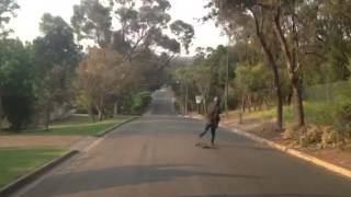 Stoned kid stacks it on longboard