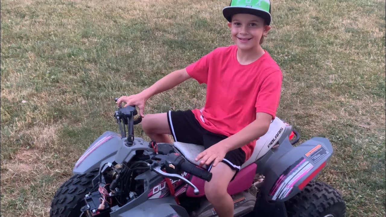 10 year old mechanic gets Polaris outlaw 50 to run! Carb clean and