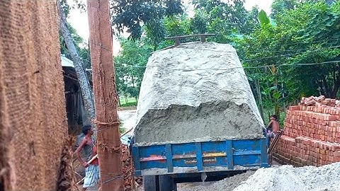 Sand is load from the river into tractors & unloading over rough road through hydraulic facilities|2
