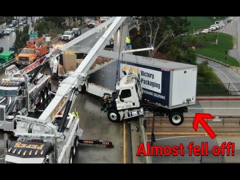 Big Rig Crashes And Is Left Dangling Off Freeway Bridge In Los Angeles!