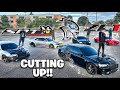 Fast cars cut up in traffic