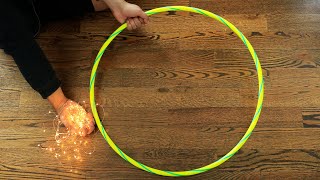Wrap string light around a hula hoop for this GORGEOUS lighting idea!