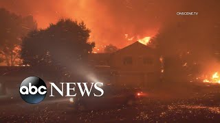 Firefighters used saws to reach gated communities and those who stayed
behind were fighting the blazes with garden hoses; red-flag warnings
extended in ...