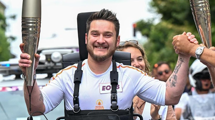 Adaptive Athlete Kevin Piette Carries Olympic Torch While Walking In An Exoskeleton