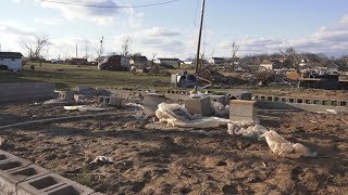 Neighborhood sorts through Tornado damage, some neighbors still hospitalized