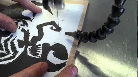 2 scroll saw portraits from one cut