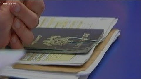Why do you need to be careful with your passport photo smile?