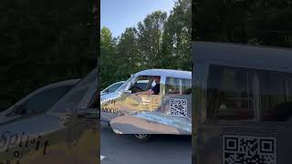 Person Recording a Fascinating Custom Airplane Like Car on the Road