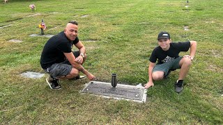 The grave of Travis the chimp and Sandra herold with a special guest