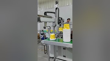 Plastic bucket handle assembling machine