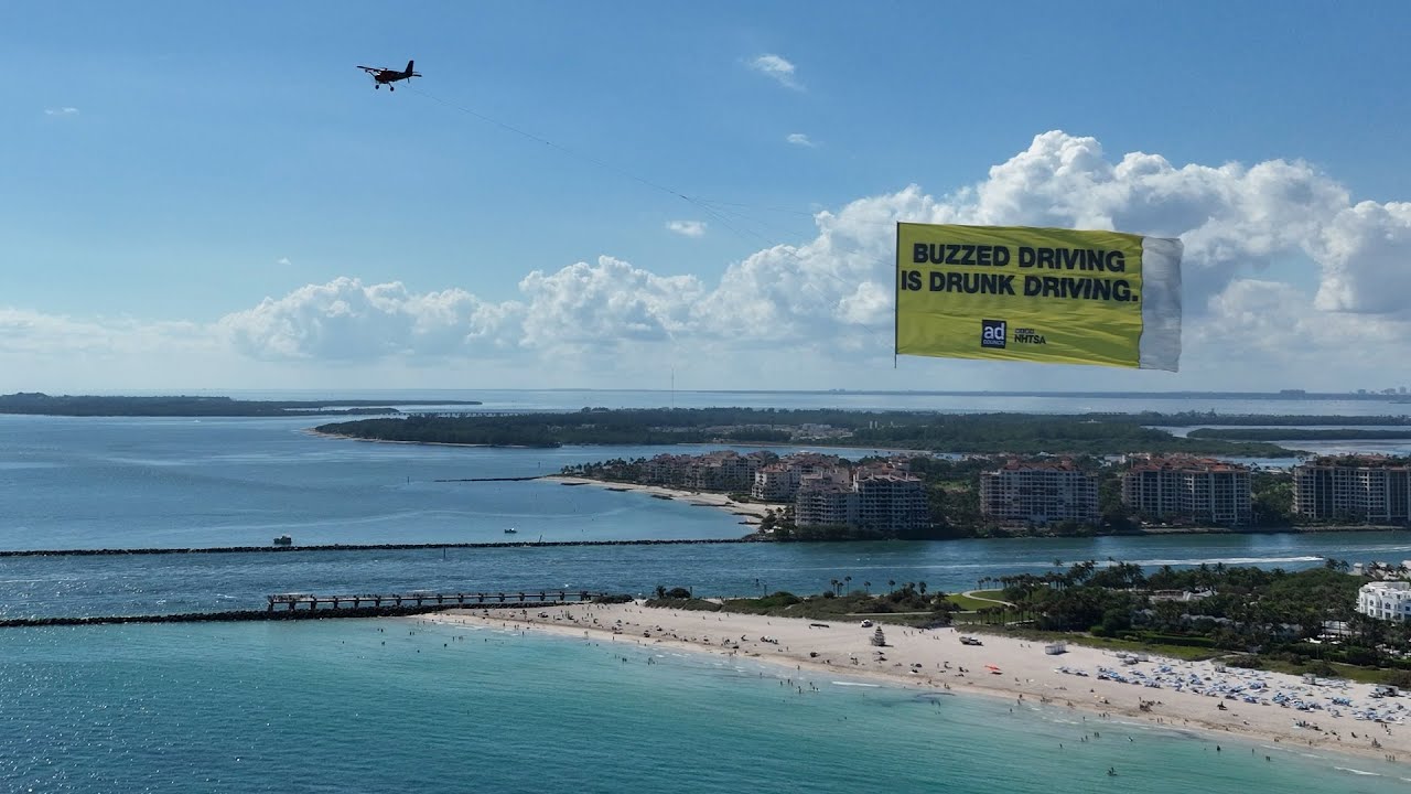 Drone pulls advertising banner over South Beach