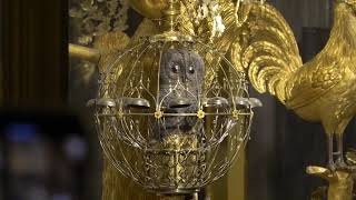 Winding the Peacock mechanical clock at the Hermitage, St. Petersburg Russia.