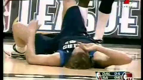 Dirk Nowitzki runs into Dampier