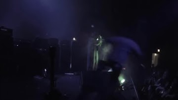 guy stage dives at a Sunn O))) concert