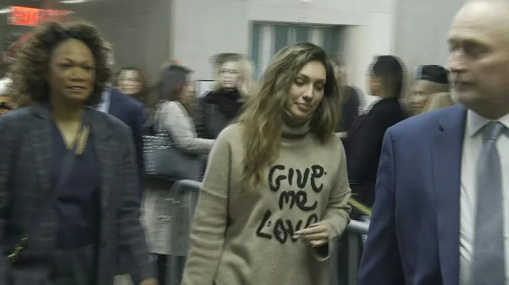 Lawyers and plaintiff Jessica Mann arrive at court...