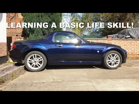 Teaching my son how to change a car wheel safely (using the tools that come with the car)