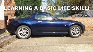 Teaching my son how to change a car wheel safely (using the tools that come with the car)