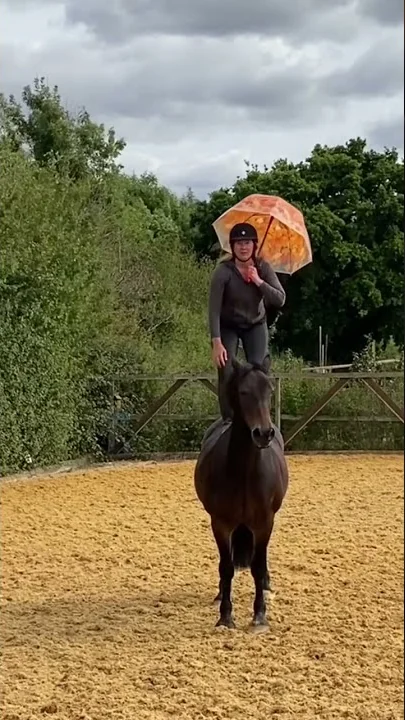 Jumping off a horse with an umbrella