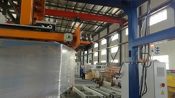 Rotary arm wrapping machine - feeding & cutting film at high position