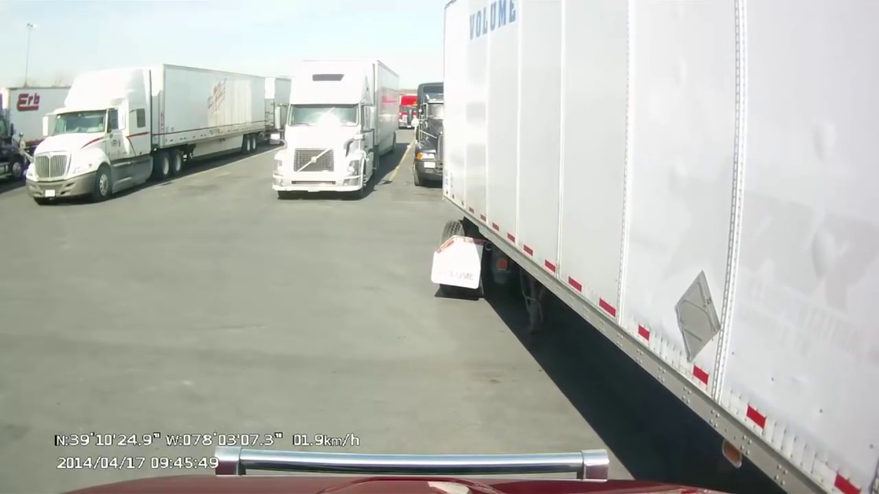 Tractor Trailer Hits Semi While Trying To Leave Parking Spot - YouTube