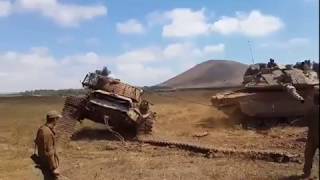 Merkava IV flipping an old Tank