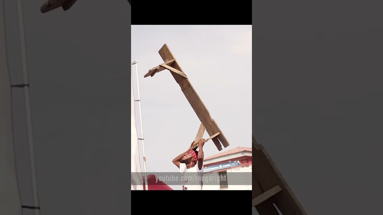 This man can balance a 6ft bench on his forehead standing on a plastic chair 