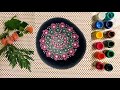 Dot mandala art on rock