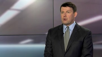 Why are organizations divesting assets to support their growth strategy?