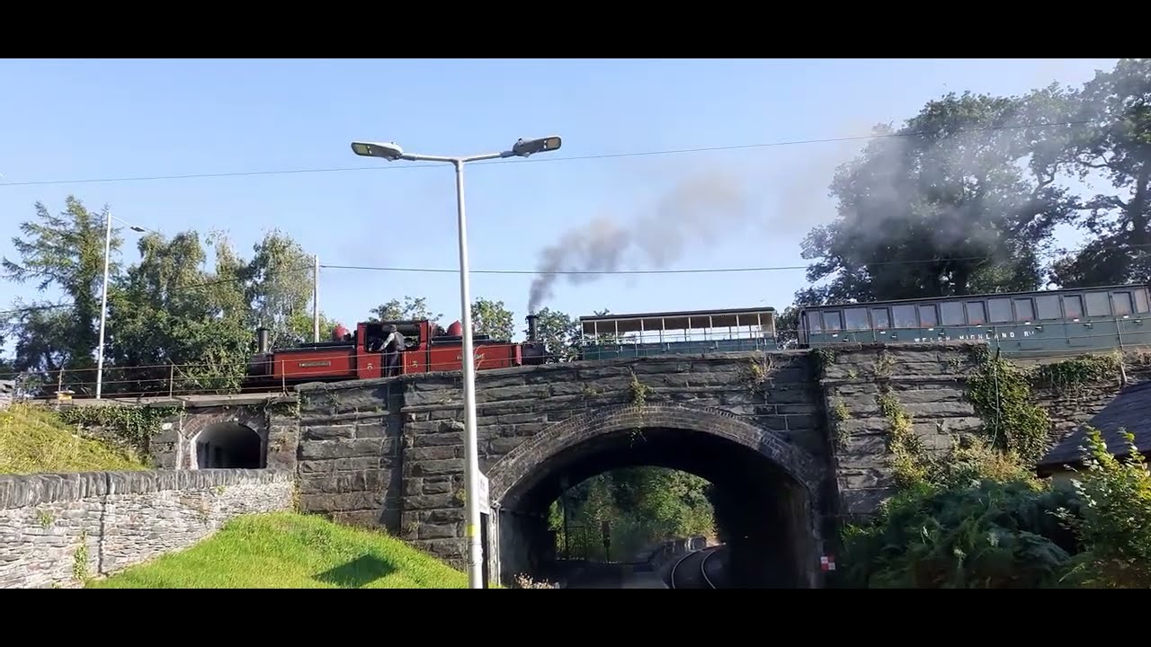 Colonel Stephens livery Ffestiniog train crossing the main line at Minffordd