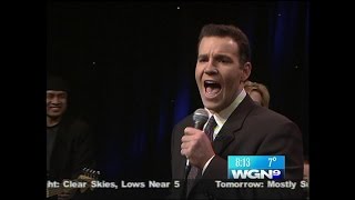WGN anchor Larry Potash karaokes '867-5309' on live TV