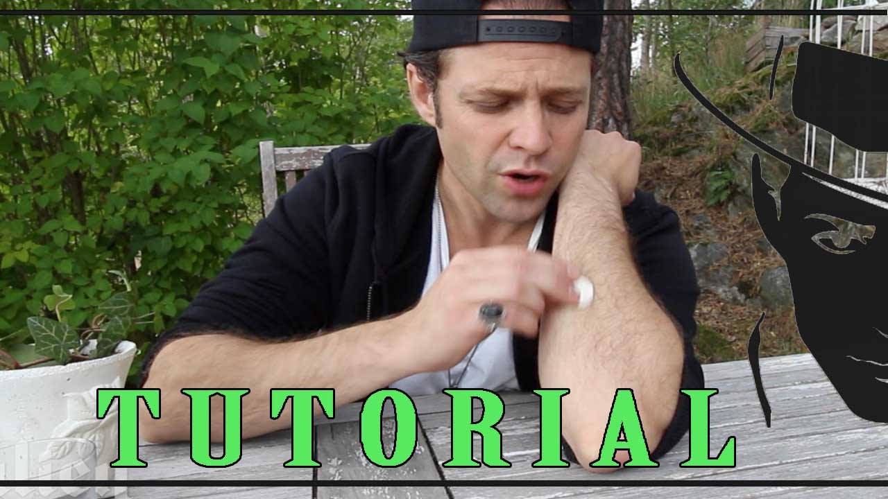 How to rub a coin into your arm magic trick tutorial -Julien Magic