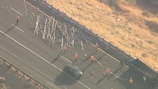 5 Freeway's NB traffic backed up for miles after big rig crash spills metal poles near Grapevine