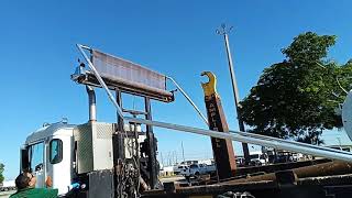 GovDeals: 70616/ 2015 Peterbilt 320, equipped with roll off