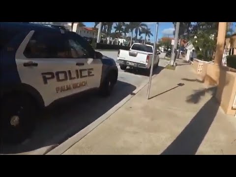 He’s Got A Fishing Pole, American Flag, And A Rifle. Open Carry Town Of Palm Beach