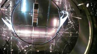 Glass elevator at Apple Store night time.AVI