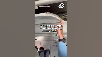 Delta flight passengers forced to hold ceiling panel up