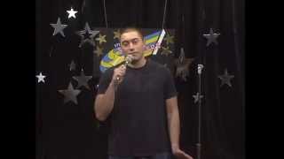 Andrew Burcastro performs stand-up comedy.