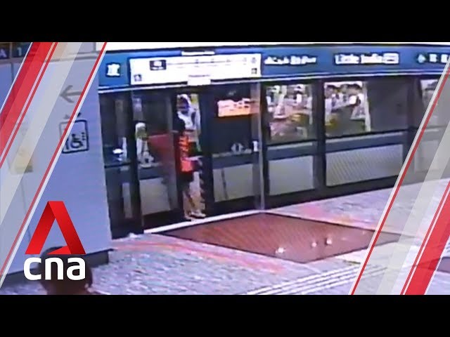 Woman forces platform doors open, tries to pry open MRT doors after missing train class=