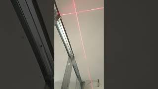 Construction of drywall partition walls using a laser level.