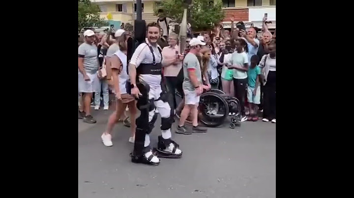 Paraplegic athlete Kevin Piette carries Olympic torch using robot exoskeleton