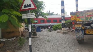 The Red LHB Rajadhani Express Crossing Mallepadu Railway gate